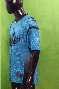 "Youth team in matching American football uniforms posing before the game"

